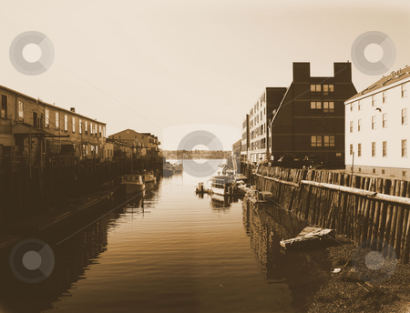 To use this stock image in your creative project, please select the size you need over to the right and click the "Add to Cart" button.
Your downloaded image will come with the Cutcaster watermark removed so don’t worry about the watermark you see on this page. Vintage view of Portland Harbor stock photo, Lobster boats in harbor ready to start the day. by Tim Markley