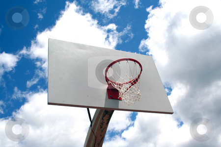 To use this stock image in your creative project, please select the size you need over to the right and click the "Add to Cart" button.
Your downloaded image will come with the Cutcaster watermark removed so don’t worry about the watermark you see on this page. Basketball hoop against sky stock photo, An image of a Basketball hoop against a cloudy sky by Jim Mills