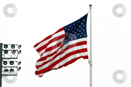 To use this stock image in your creative project, please select the size you need over to the right and click the "Add to Cart" button.
Your downloaded image will come with the Cutcaster watermark removed so don’t worry about the watermark you see on this page. American Flag with stadium lights stock photo, An image of the American Flag with stadium lights by Jim Mills