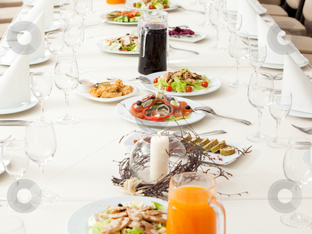 Served restaurant table Served restaurant table stock photo, Long served restaurant table eith snacks and salads by Ruta Balciunaite