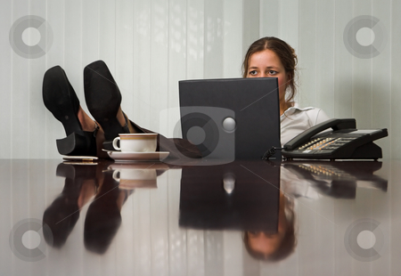 To use this stock image in your creative project, please select the size you need over to the right and click the "Add to Cart" button.
Your downloaded image will come with the Cutcaster watermark removed so don’t worry about the watermark you see on this page. Relaxed stock photo, Young woman with laptop in meeting room, with her feet on the table by Anneke