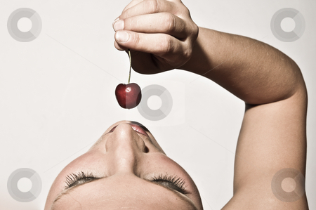 To use this stock image in your creative project, please select the size you need over to the right and click the "Add to Cart" button.
Your downloaded image will come with the Cutcaster watermark removed so don’t worry about the watermark you see on this page. Woman Sensually Tasting A Cherry stock photo, Upper View Closeup Of A Woman Sensually Tasting A Cherry by Nick Fingerhut