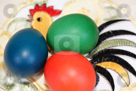 To use this stock image in your creative project, please select the size you need over to the right and click the "Add to Cart" button.
Your downloaded image will come with the Cutcaster watermark removed so don’t worry about the watermark you see on this page. Easter eggs stock photo, Three colourful eggs on napkin with cock by Jolanta Dabrowska