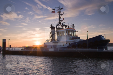 To use this stock image in your creative project, please select the size you need over to the right and click the "Add to Cart" button.
Your downloaded image will come with the Cutcaster watermark removed so don’t worry about the watermark you see on this page. Tugship in port stock photo, Tug at sunrise just before leaving port by Colette Planken-Kooij