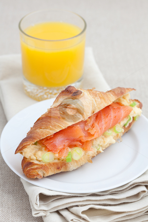 To use this stock image in your creative project, please select the size you need over to the right and click the "Add to Cart" button.
Your downloaded image will come with the Cutcaster watermark removed so don’t worry about the watermark you see on this page. Croissant with smoked salmon and scrambled eggs stock photo, Fresh croissant with smoked salmon, scrambled eggs and garnished with spring onion by Robert Anthony
