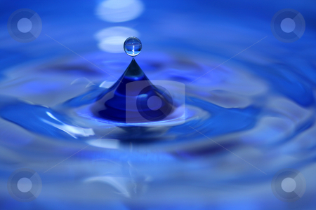 To use this stock image in your creative project, please select the size you need over to the right and click the "Add to Cart" button.
Your downloaded image will come with the Cutcaster watermark removed so don’t worry about the watermark you see on this page. Water droplet splash stock photo, A blue water droplet splashing by Jim Mills