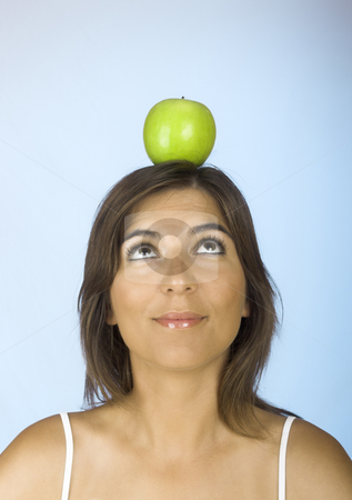 To use this stock image in your creative project, please select the size you need over to the right and click the "Add to Cart" button.
Your downloaded image will come with the Cutcaster watermark removed so don’t worry about the watermark you see on this page. Apple on the head stock photo, Portrait of a young woman with a apple on the head by ikostudio