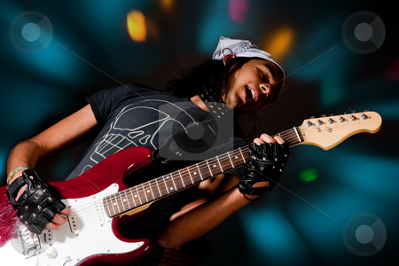 To use this stock image in your creative project, please select the size you need over to the right and click the "Add to Cart" button.
Your downloaded image will come with the Cutcaster watermark removed so don’t worry about the watermark you see on this page. Spotlights stock photo, Young handsome rock singer against a dark background with spot lights by Anneke