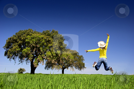Happy Jump Happy Jump stock photo, Haapy woman jumping on a beautiful green meadow with trees by ikostudio
