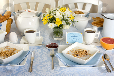 To use this stock image in your creative project, please select the size you need over to the right and click the "Add to Cart" button.
Your downloaded image will come with the Cutcaster watermark removed so don’t worry about the watermark you see on this page. Breakfast for mommy stock photo, Mother's day breakfast table with eggs, toast and cereals by Anneke