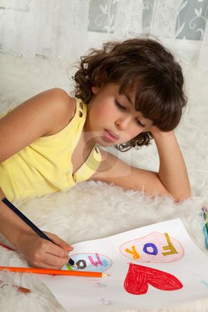 To use this stock image in your creative project, please select the size you need over to the right and click the "Add to Cart" button.
Your downloaded image will come with the Cutcaster watermark removed so don’t worry about the watermark you see on this page. Drawing for her mother stock photo, Little girl making a drawing for mother's day by Anneke