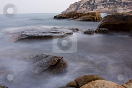 To use this stock image in your creative project, please select the size you need over to the right and click the "Add to Cart" button.
Your downloaded image will come with the Cutcaster watermark removed so don’t worry about the watermark you see on this page. Rock coast background stock photo, Long exposure of rock coast background by Keng po Leung