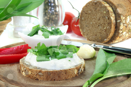 Cottage cheese bread with wild garlic Cottage cheese bread with wild garlic stock photo, A slice of bread with cottage cheese and freshly chopped wild garlic by Marén Wischnewski