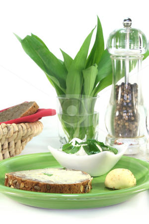 To use this stock image in your creative project, please select the size you need over to the right and click the "Add to Cart" button.
Your downloaded image will come with the Cutcaster watermark removed so don’t worry about the watermark you see on this page. Wild garlic curd stock photo, A slice of bread with wild garlic curd by Simone Voigt