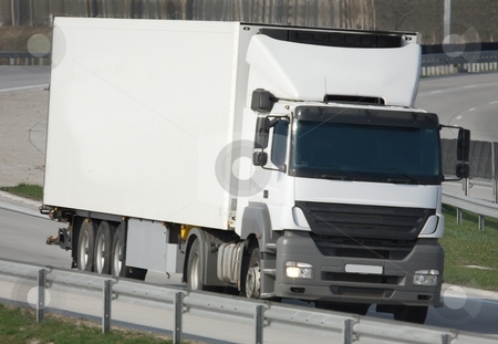 To use this stock image in your creative project, please select the size you need over to the right and click the "Add to Cart" button.
Your downloaded image will come with the Cutcaster watermark removed so don’t worry about the watermark you see on this page. Truck stock photo, Big white truck on the highway by P?