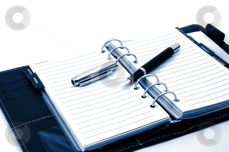 To use this stock image in your creative project, please select the size you need over to the right and click the "Add to Cart" button.
Your downloaded image will come with the Cutcaster watermark removed so don’t worry about the watermark you see on this page. Notebook stock photo, Empty business notebook or organizer with pen by Gunnar Pippel