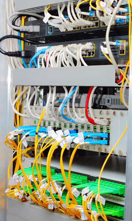 To use this stock image in your creative project, please select the size you need over to the right and click the "Add to Cart" button.
Your downloaded image will come with the Cutcaster watermark removed so don’t worry about the watermark you see on this page. Fiber optic datacenter with media converters and optical cables stock photo, Fiber optic datacenter with media converters and optical cables by Artush
