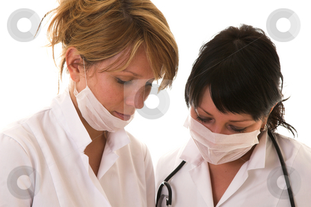 After the operation After the operation stock photo, Two nurses checking their work after the operation by Simone Van den Berg