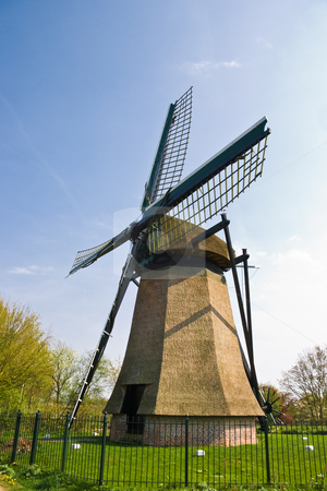 To use this stock image in your creative project, please select the size you need over to the right and click the "Add to Cart" button.
Your downloaded image will come with the Cutcaster watermark removed so don’t worry about the watermark you see on this page. Dutch mill stock photo, Dutch mill with fence on sunny april afternoon by Colette Planken-Kooij