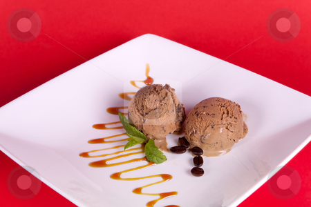 To use this stock image in your creative project, please select the size you need over to the right and click the "Add to Cart" button.
Your downloaded image will come with the Cutcaster watermark removed so don’t worry about the watermark you see on this page. Mocha dessert stock photo, Mocha ice cream (coffee taste) with caramel sauce by Anneke