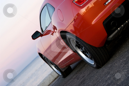 To use this stock image in your creative project, please select the size you need over to the right and click the "Add to Cart" button.
Your downloaded image will come with the Cutcaster watermark removed so don’t worry about the watermark you see on this page. Modern Sports Car stock photo, A modern sports car parked at the beach around sunset. by Todd Arena