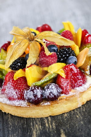 Mixed tropical fruit tart Mixed tropical fruit tart stock photo, Fresh dessert fruit tart covered in assorted tropical fruits by Elena Elisseeva