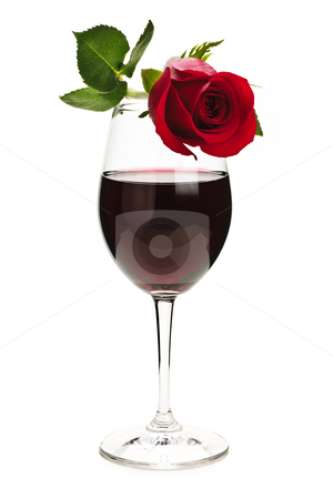 Wine with red rose Wine with red rose stock photo, Romantic rose on top of red wine glass isolated on white background by Elena Elisseeva
