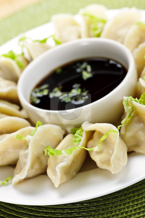 To use this stock image in your creative project, please select the size you need over to the right and click the "Add to Cart" button.
Your downloaded image will come with the Cutcaster watermark removed so don’t worry about the watermark you see on this page. Steamed dumplings and soy sauce stock photo, Closeup on plate of steamed dumplings with soy sauce by Elena Elisseeva