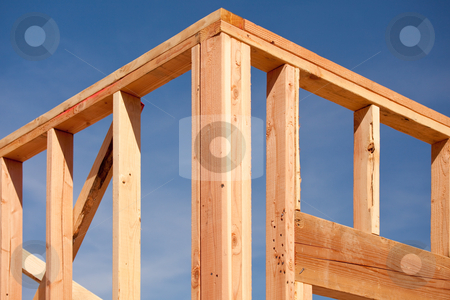 To use this stock image in your creative project, please select the size you need over to the right and click the "Add to Cart" button.
Your downloaded image will come with the Cutcaster watermark removed so don’t worry about the watermark you see on this page. New Home Construction Framing stock photo, New Residential Home Construction Framing Site Against Blue Sky. by Andy Dean