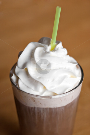 To use this stock image in your creative project, please select the size you need over to the right and click the "Add to Cart" button.
Your downloaded image will come with the Cutcaster watermark removed so don’t worry about the watermark you see on this page. Iced Coffee Drink stock photo, A delicious iced coffee drink topped with fresh whipped cream. Shallow depth of field. by Todd Arena