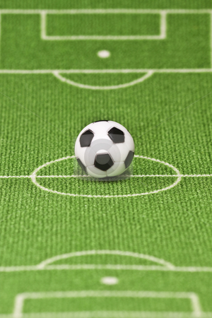 Soccer ball Soccer ball stock photo, Symbol photo toy soccer ball on a football field. Shot in studio. by Birgit Reitz-Hofmann