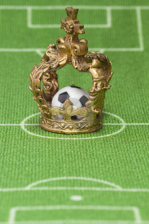 To use this stock image in your creative project, please select the size you need over to the right and click the "Add to Cart" button.
Your downloaded image will come with the Cutcaster watermark removed so don’t worry about the watermark you see on this page. Soccer trophy stock photo, Symbol photo - crown on a soccer field. Shot in studio. by Birgit Reitz-Hofmann