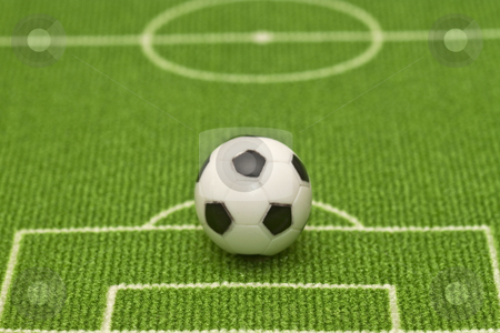 To use this stock image in your creative project, please select the size you need over to the right and click the "Add to Cart" button.
Your downloaded image will come with the Cutcaster watermark removed so don’t worry about the watermark you see on this page. Soccer ball stock photo, Symbol photo toy soccer ball on a football field. Shot in studio. by Birgit Reitz-Hofmann
