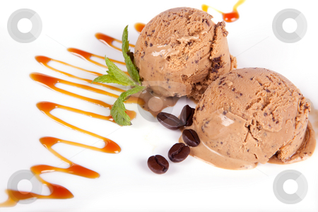 To use this stock image in your creative project, please select the size you need over to the right and click the "Add to Cart" button.
Your downloaded image will come with the Cutcaster watermark removed so don’t worry about the watermark you see on this page. Coffee ice cream stock photo, Scoops of coffee ice cream with caramel sauce by Anneke