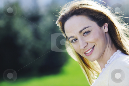 Young woman outdoor portrait Young woman outdoor portrait stock photo, Happy young beautiful woman face closeup and portrait outdoor at sunny day by Benis Arapovic
