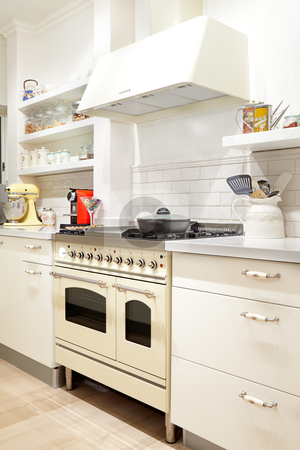 To use this stock image in your creative project, please select the size you need over to the right and click the "Add to Cart" button.
Your downloaded image will come with the Cutcaster watermark removed so don’t worry about the watermark you see on this page. New kitchen in a modern home stock photo, Modern design kitchen with white and wood elements by Dmitry Pistrov