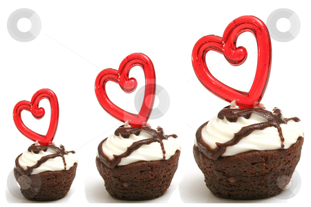 To use this stock image in your creative project, please select the size you need over to the right and click the "Add to Cart" button.
Your downloaded image will come with the Cutcaster watermark removed so don’t worry about the watermark you see on this page. Three heart brownies in a row stock photo, Three heart brownies in a row by Andi Berger