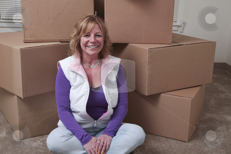 To use this stock image in your creative project, please select the size you need over to the right and click the "Add to Cart" button.
Your downloaded image will come with the Cutcaster watermark removed so don’t worry about the watermark you see on this page. Moving in stock photo, Attractive Caucasian woman sits in front of a pile of boxes. by Christy Thompson