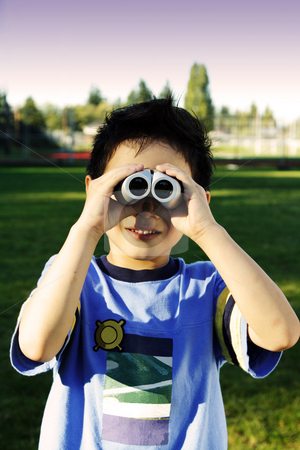 To use this stock image in your creative project, please select the size you need over to the right and click the "Add to Cart" button.
Your downloaded image will come with the Cutcaster watermark removed so don’t worry about the watermark you see on this page. Happy kid stock photo, A boy looking through a binocular by Suprijono Suharjoto