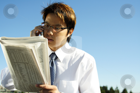 To use this stock image in your creative project, please select the size you need over to the right and click the "Add to Cart" button.
Your downloaded image will come with the Cutcaster watermark removed so don’t worry about the watermark you see on this page. Businessman stock photo, Businessman reading financial newspaper while making a phone call by Suprijono Suharjoto