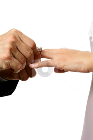 To use this stock image in your creative project, please select the size you need over to the right and click the "Add to Cart" button.
Your downloaded image will come with the Cutcaster watermark removed so don’t worry about the watermark you see on this page. Wedding stock photo, The groom inserting a diamond wedding ring into the bride's finger by Suprijono Suharjoto