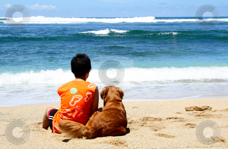 Best friends Best friends stock photo, A boy and a golden retriever sitting on the beach by Suprijono Suharjoto