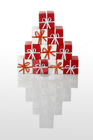 To use this stock image in your creative project, please select the size you need over to the right and click the "Add to Cart" button.
Your downloaded image will come with the Cutcaster watermark removed so don’t worry about the watermark you see on this page. Christmas gifts stock photo, Pyramid made with small gift boxes isolated on white with reflection by ikostudio