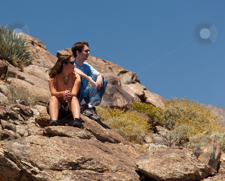Hikers in desert look at distant object Hikers in desert look at distant object stock photo, Male and female hikers in Anze Borrego desert look to distance by Steven Heap