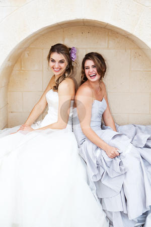 To use this stock image in your creative project, please select the size you need over to the right and click the "Add to Cart" button.
Your downloaded image will come with the Cutcaster watermark removed so don’t worry about the watermark you see on this page. Young Women in Gowns and Sitting in an Alcove stock photo, Two attractive young women wearing formal dresses are smiling and sitting back to back in an alcove. Vertical shot. by Angela Hawkey