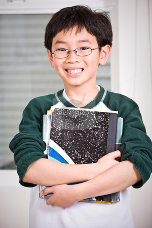 To use this stock image in your creative project, please select the size you need over to the right and click the "Add to Cart" button.
Your downloaded image will come with the Cutcaster watermark removed so don’t worry about the watermark you see on this page. Young student stock photo, A shot of an asian kid carrying books by Suprijono Suharjoto