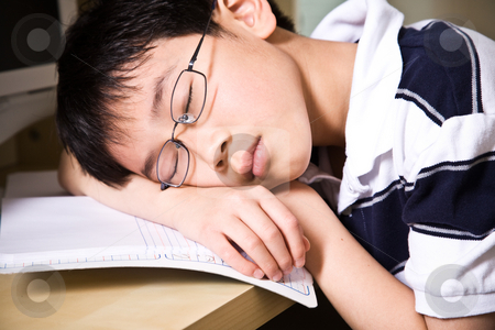 Sleeping young student Sleeping young student stock photo, A shot of an asian student falling asleep while studying at home by Suprijono Suharjoto