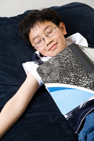 To use this stock image in your creative project, please select the size you need over to the right and click the "Add to Cart" button.
Your downloaded image will come with the Cutcaster watermark removed so don’t worry about the watermark you see on this page. Sleeping young student stock photo, A shot of an asian kid sleeping while studying at home by Suprijono Suharjoto