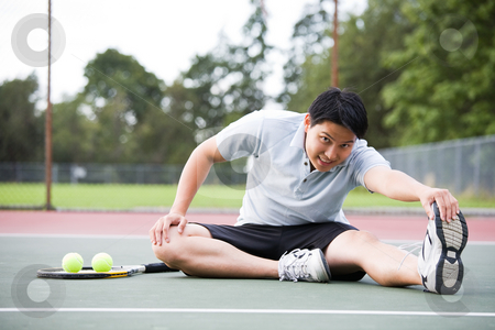 Asian tennis player Asian tennis player stock photo, A young asian male tennis player stretching before playing by Suprijono Suharjoto