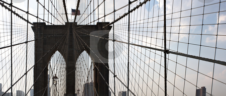 To use this stock image in your creative project, please select the size you need over to the right and click the "Add to Cart" button.
Your downloaded image will come with the Cutcaster watermark removed so don’t worry about the watermark you see on this page. Brooklyn Bridge stock photo, The famous and historic Brooklyn Bridge located in New York City. by Todd Arena